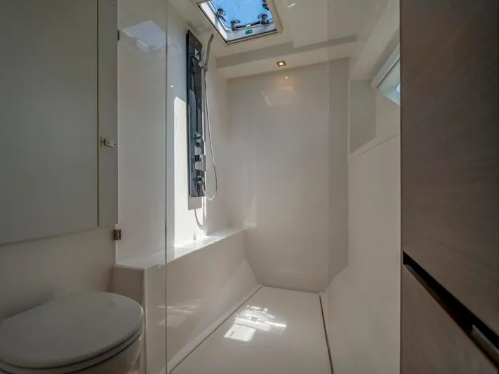 Breathe Yacht Photos Pics Modern bathroom interior on 2020 Leopard 53 Powercat yacht, featuring sleek design and skylight.