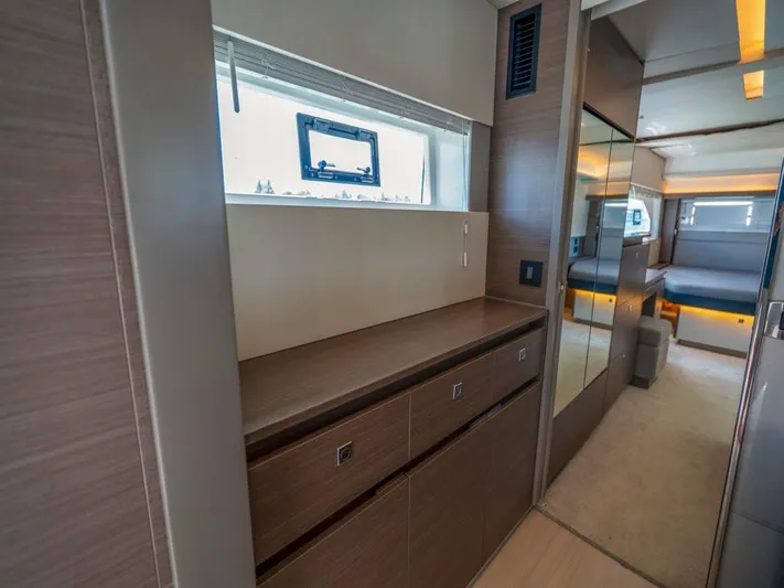 Breathe Yacht Photos Pics Interior of 2020 Leopard 53 Powercat yacht, featuring modern wood cabinetry and spacious layout.