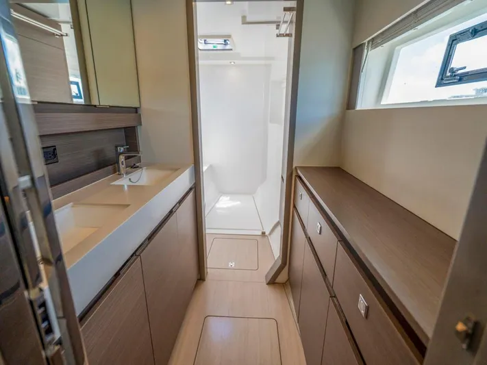 Breathe Yacht Photos Pics Modern bathroom interior on 2020 Leopard 53 Powercat yacht, featuring sleek cabinetry and dual sinks.
