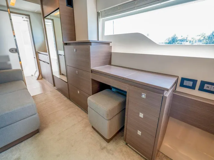 Breathe Yacht Photos Pics Luxurious interior of 2020 Leopard 53 Powercat with modern wood cabinetry and seating.