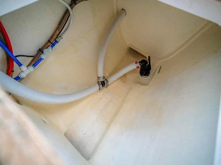 Breathe Yacht Photos Pics 2020 Leopard 53 Powercat interior plumbing with hoses and fittings.