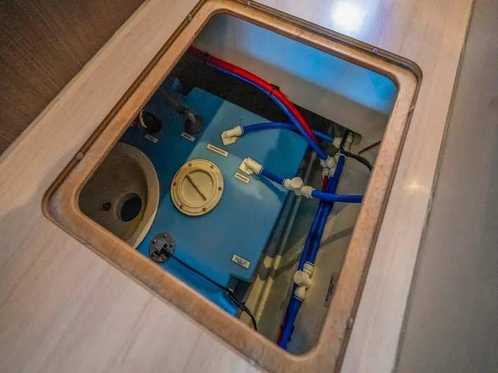 Breathe Yacht Photos Pics Engine compartment of 2020 Leopard 53 Powercat with visible blue and red piping.