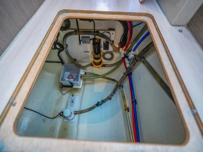 Breathe Yacht Photos Pics Bilge compartment of 2020 Leopard 53 Powercat with visible plumbing and wiring.