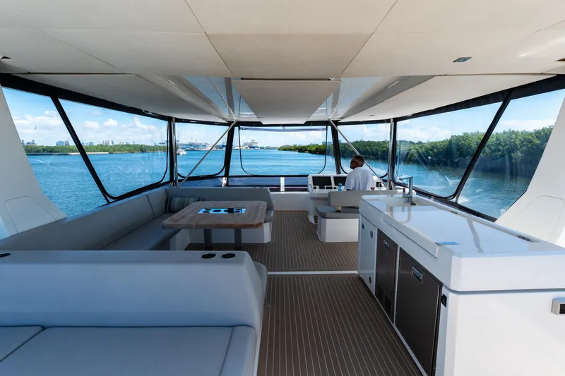 Breathe Yacht Photos Pics Luxurious interior of 2020 Leopard 53 Powercat yacht with panoramic windows and modern amenities.