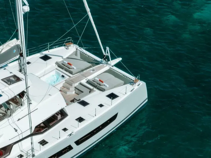Roamance Yacht Photos Pics Luxury Fountaine Pajot Alegria 67 catamaran sailing on clear turquoise waters, 2022 model.