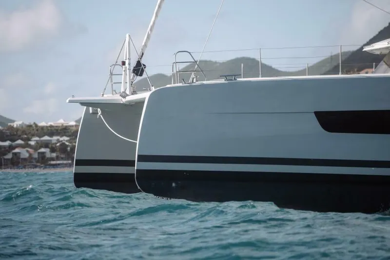 Roamance Yacht Photos Pics 2022 Fountaine Pajot Alegria 67 catamaran sailing on blue ocean waters.