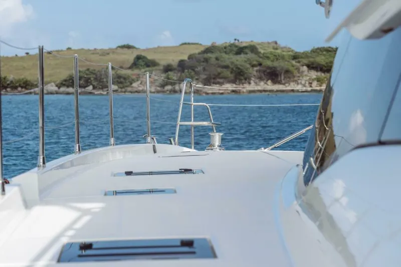 Roamance Yacht Photos Pics 2022 Fountaine Pajot Alegria 67 yacht deck with scenic ocean view.
