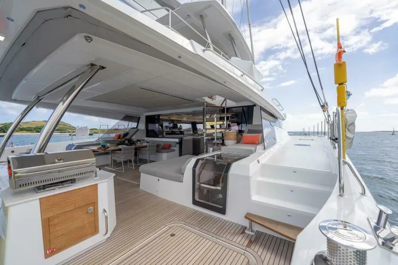 Roamance Yacht Photos Pics Luxurious 2022 Fountaine Pajot Alegria 67 yacht with spacious deck and modern amenities.