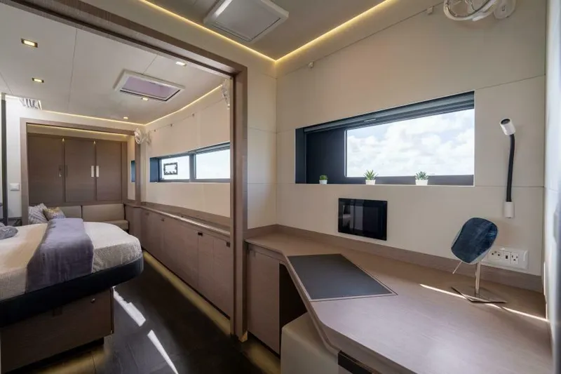 Roamance Yacht Photos Pics Luxurious interior of 2022 Fountaine Pajot Alegria 67 yacht cabin with modern furnishings.