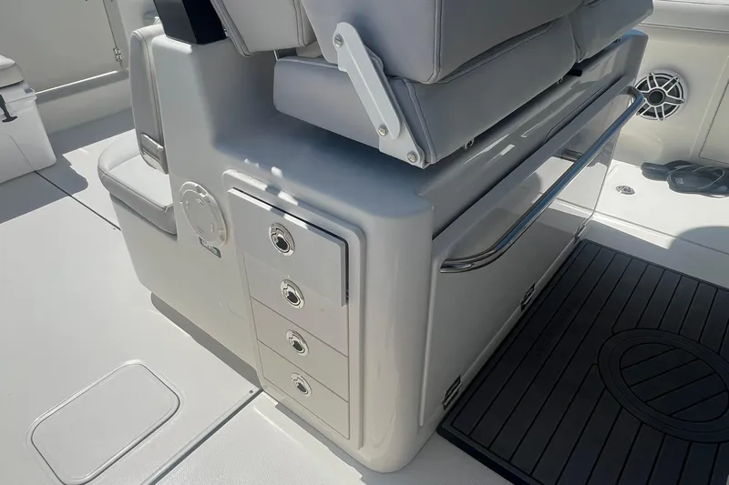  Yacht Photos Pics 2024 World Cat 325 CC boat interior with storage drawers and seating.