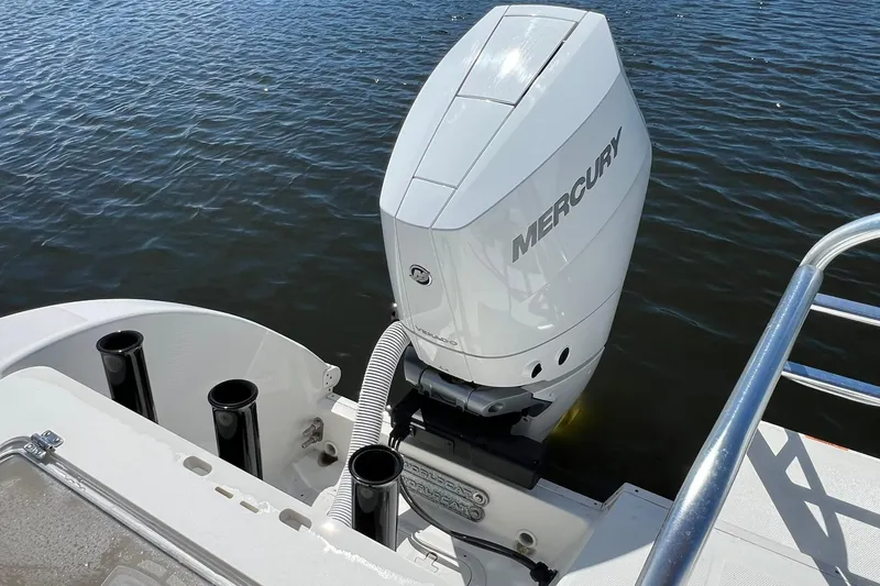  Yacht Photos Pics 2024 World Cat 325 CC boat with Mercury outboard engine on water.