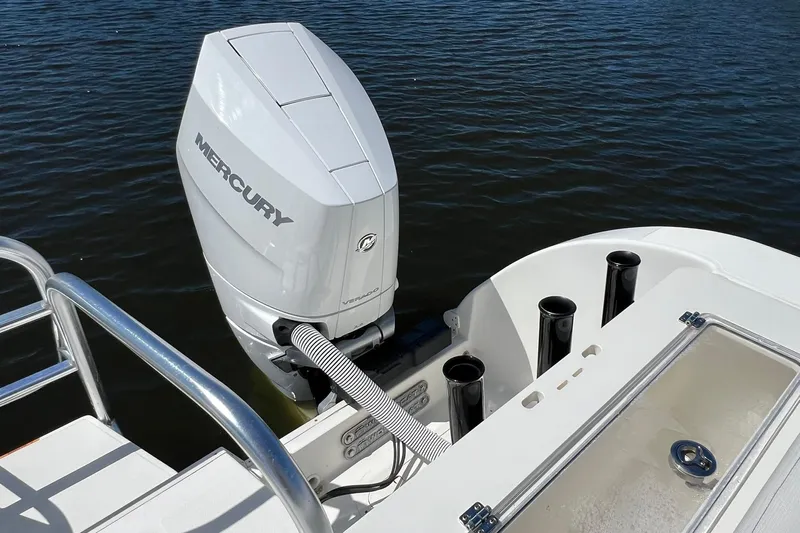  Yacht Photos Pics 2024 World Cat 325 CC boat with Mercury outboard engine on water.