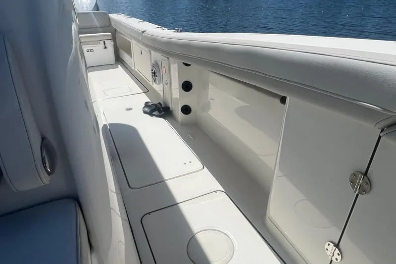  Yacht Photos Pics 2024 World Cat 325 CC boat interior with sleek white seating and storage compartments.