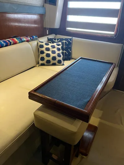  Yacht Photos Pics 1994 Luhrs 380 Tournament interior with beige seating and wooden table.