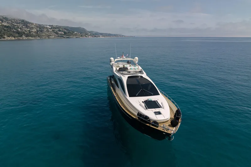 Milky Way Yacht Photos Pics Luxurious 2007 Riva Venere 75 yacht cruising on serene blue waters.