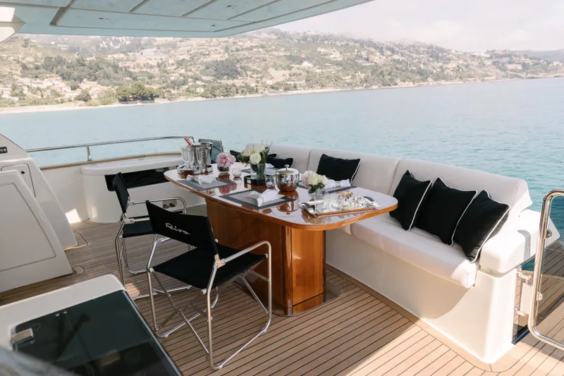 Milky Way Yacht Photos Pics Luxurious 2007 Riva Venere 75 yacht deck with elegant dining setup and scenic ocean view.