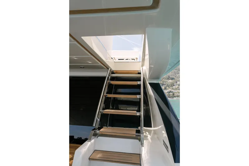 Milky Way Yacht Photos Pics Staircase on 2007 Riva Venere 75 yacht, leading to upper deck with scenic view.
