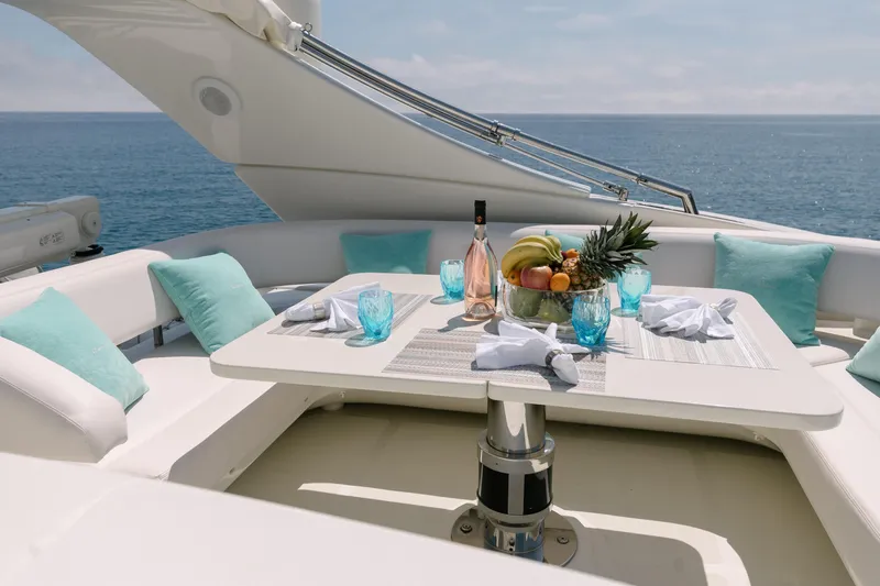 Milky Way Yacht Photos Pics Luxurious dining setup on 2007 Riva Venere 75 yacht with ocean view.