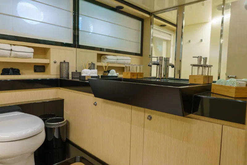 Milky Way Yacht Photos Pics Luxurious bathroom interior of 2007 Riva Venere 75 yacht with modern fixtures.