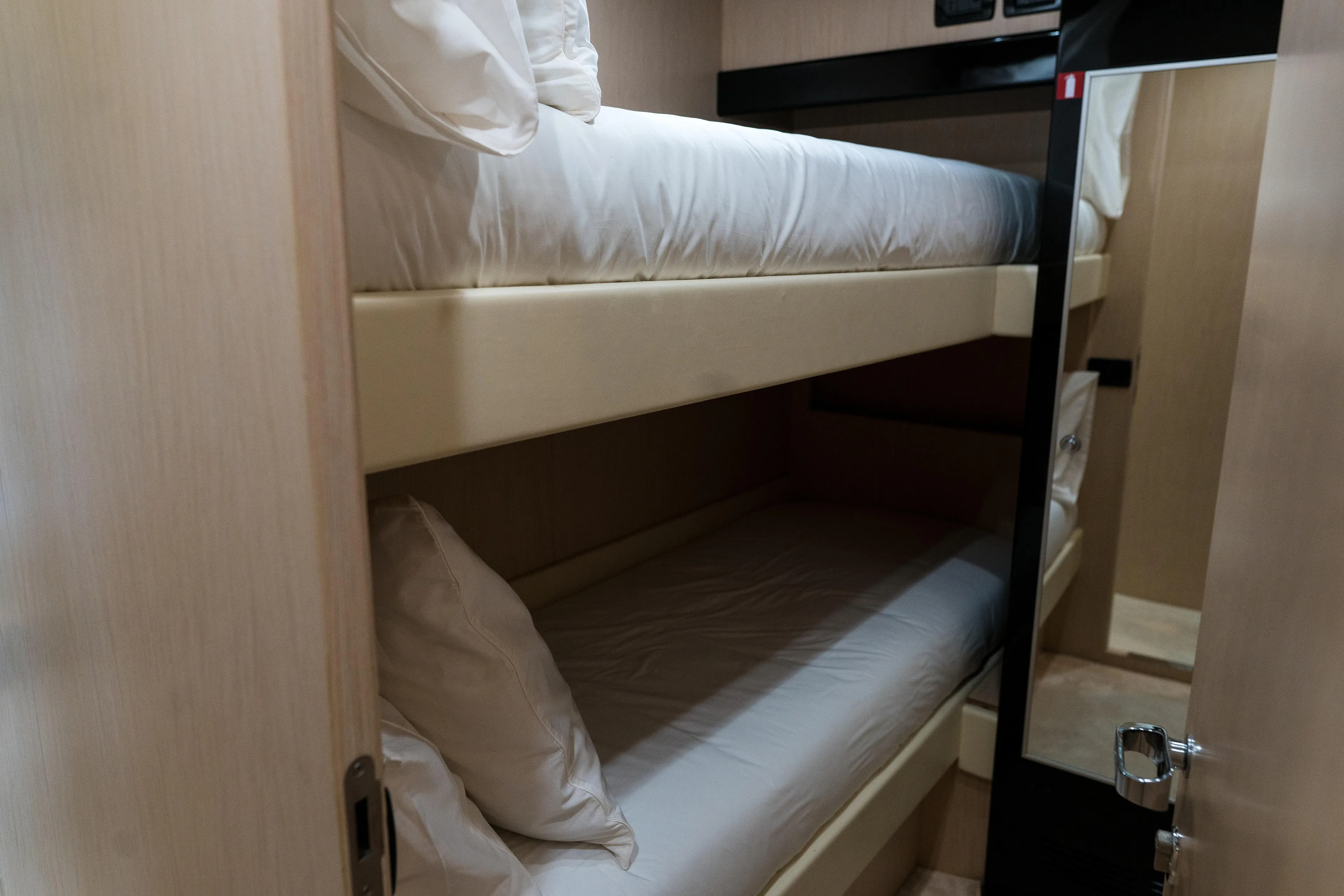 Milky Way Yacht Photos Pics Bunk beds in 2007 Riva Venere 75 yacht cabin, featuring modern design and cozy bedding.
