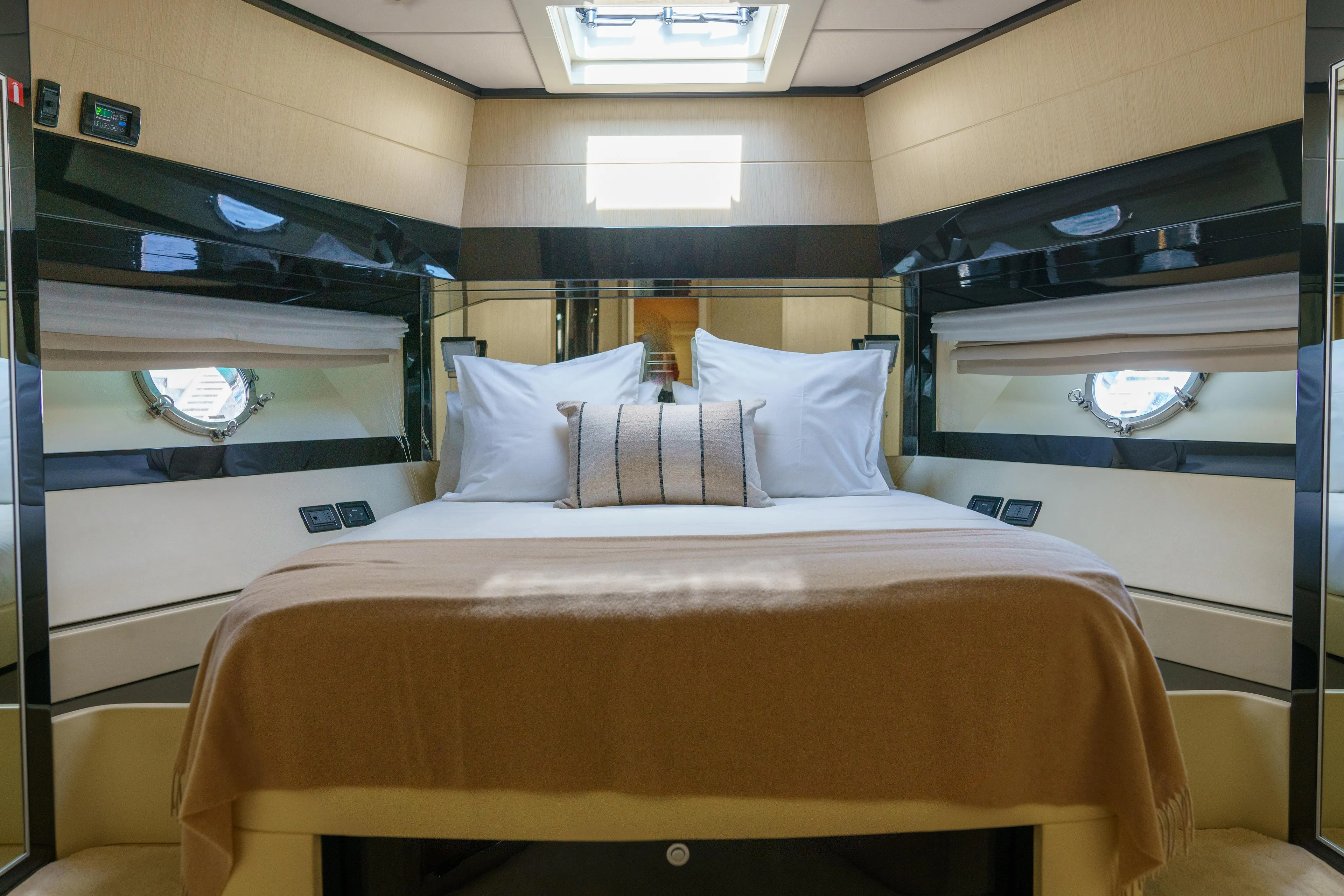 Milky Way Yacht Photos Pics Luxurious bedroom interior of 2007 Riva Venere 75 yacht with elegant bedding and porthole windows.