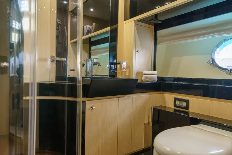 Milky Way Yacht Photos Pics Luxurious bathroom interior of 2007 Riva Venere 75 yacht with modern fixtures.