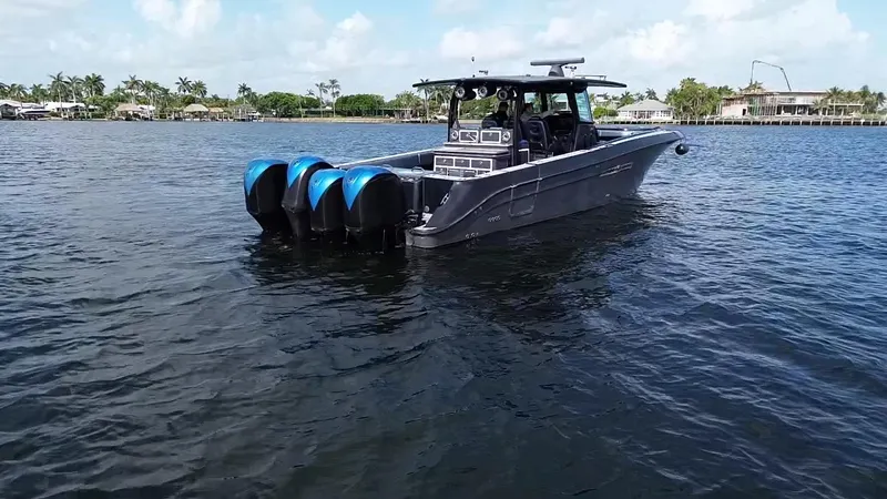  Yacht Photos Pics 2016 Hydra-Sports 4200 Siesta boat on calm water with four outboard engines.