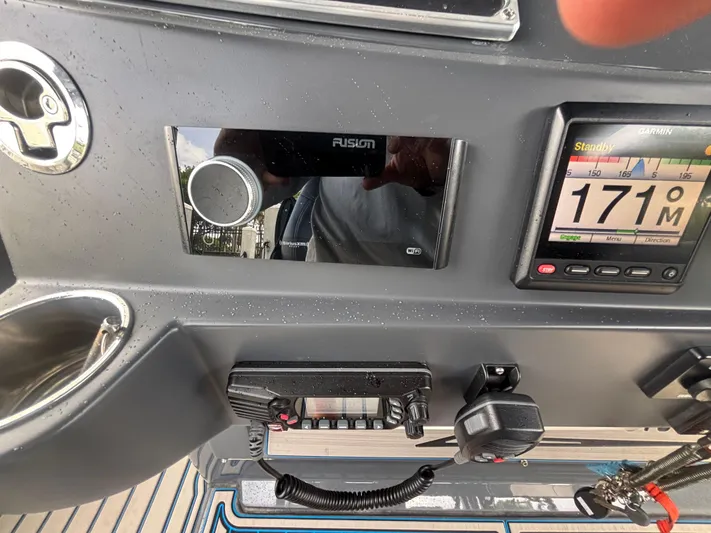  Yacht Photos Pics Control panel of 2016 Hydra-Sports 4200 Siesta boat with navigation and communication devices.