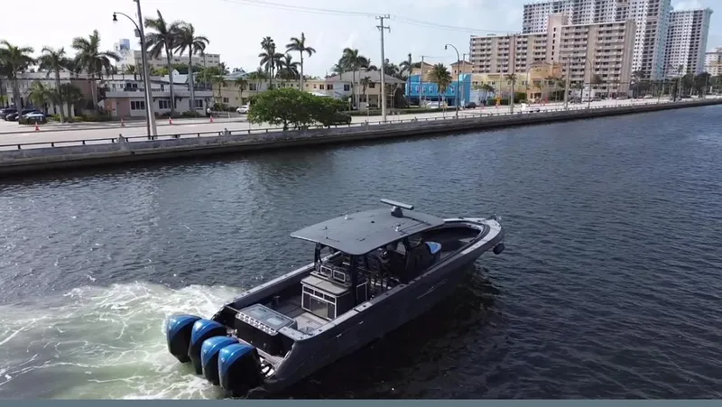  Yacht Photos Pics 2016 Hydra-Sports 4200 Siesta boat cruising near urban waterfront.