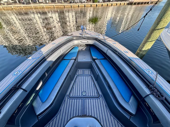  Yacht Photos Pics 2016 Hydra-Sports 4200 Siesta boat interior with blue seating, docked by waterfront.