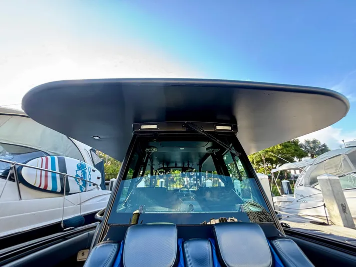  Yacht Photos Pics 2016 Hydra-Sports 4200 Siesta boat with sleek design and spacious cockpit under clear blue sky.