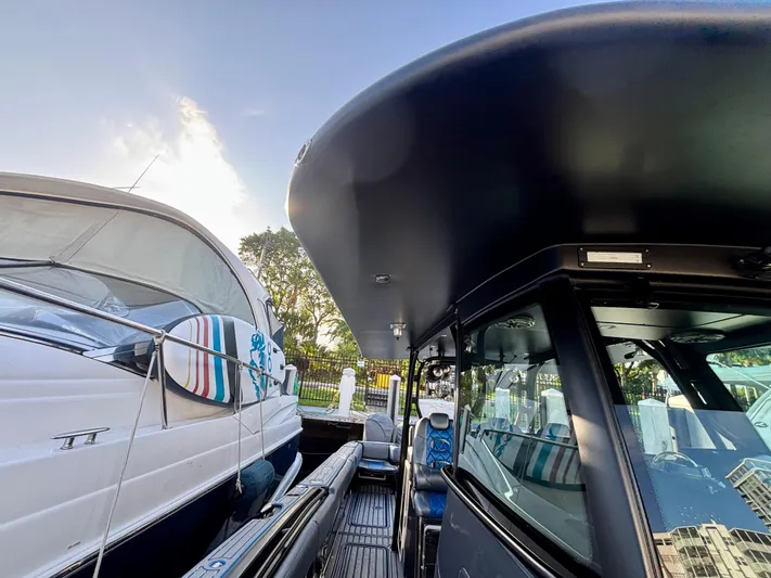 Yacht Photos Pics 2016 Hydra-Sports 4200 Siesta boat docked beside another vessel, sunny day.