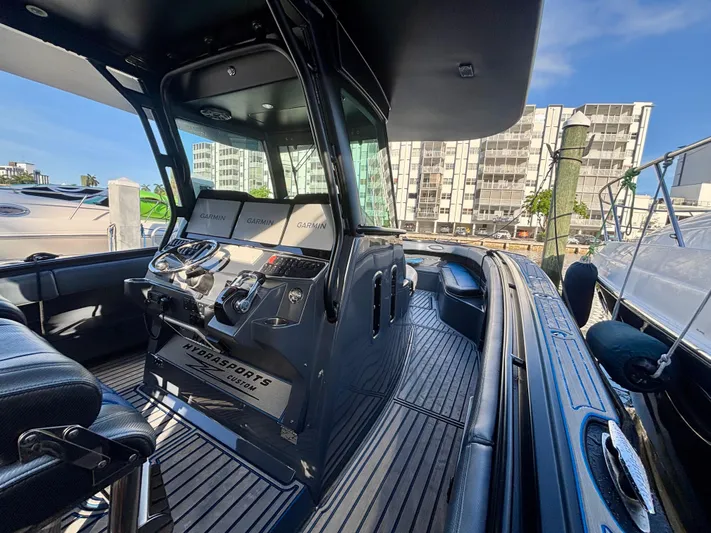  Yacht Photos Pics 2016 Hydra-Sports 4200 Siesta boat interior with Garmin navigation, docked in a marina.