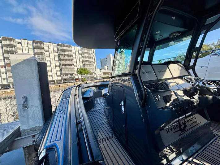  Yacht Photos Pics 2016 Hydra-Sports 4200 Siesta boat docked, featuring sleek design and modern controls.