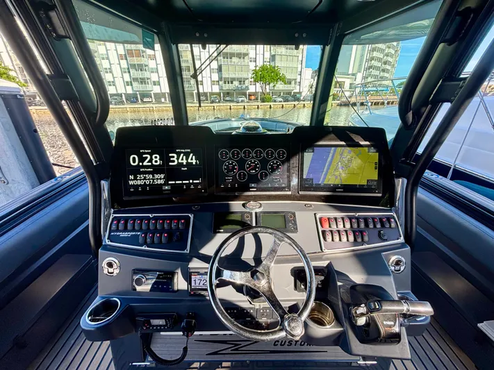  Yacht Photos Pics Helm of 2016 Hydra-Sports 4200 Siesta with navigation screens and controls.