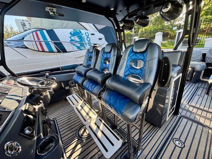  Yacht Photos Pics Interior of 2016 Hydra-Sports 4200 Siesta boat with blue leather seating and modern controls.