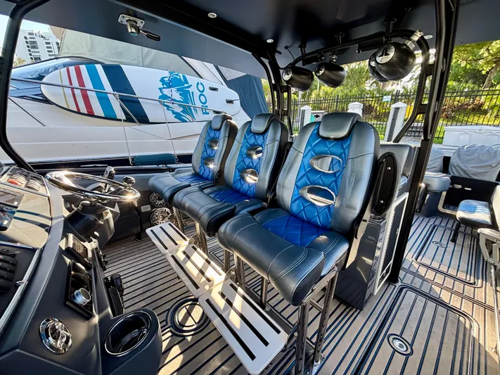  Yacht Photos Pics Interior of 2016 Hydra-Sports 4200 Siesta boat with blue leather seating and modern controls.