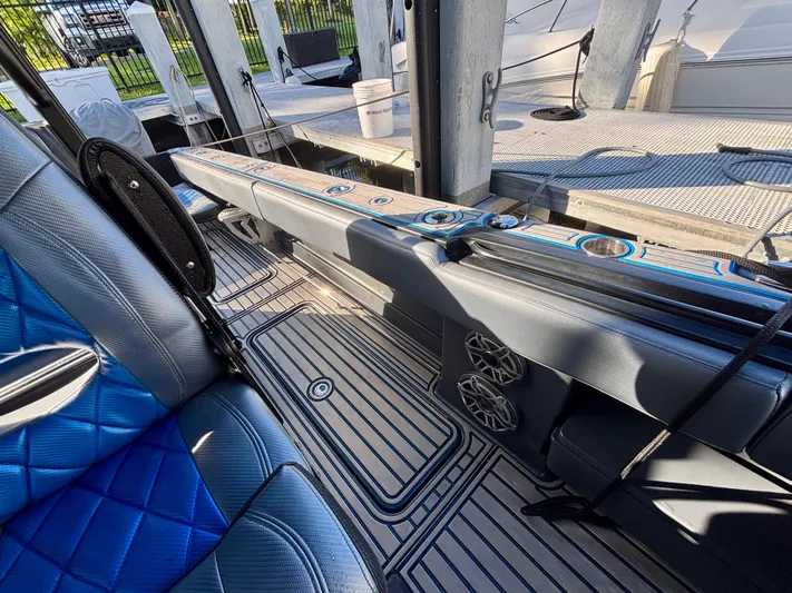  Yacht Photos Pics 2016 Hydra-Sports 4200 Siesta interior with blue seating and sleek design elements.