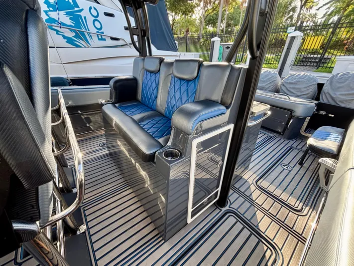  Yacht Photos Pics 2016 Hydra-Sports 4200 Siesta interior with blue and gray seating, sleek design, and striped flooring.