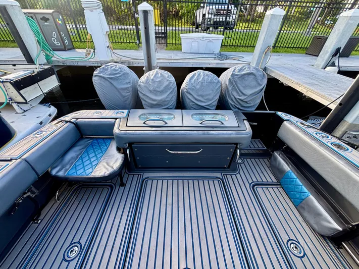  Yacht Photos Pics 2016 Hydra-Sports 4200 Siesta boat interior with seating and covered engines at dock.