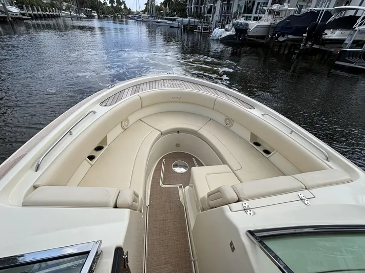  Yacht Photos Pics 2019 Chris-Craft Calypso 30 boat with elegant seating, docked in a serene marina.