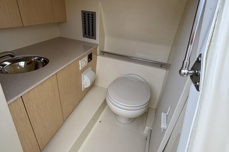  Yacht Photos Pics 2019 Chris-Craft Calypso 30 boat bathroom with sink and toilet.
