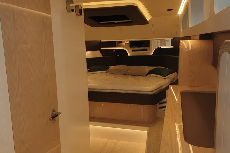  Yacht Photos Pics Luxurious interior of 2023 Canados Gladiator 493 yacht with modern bedroom design.