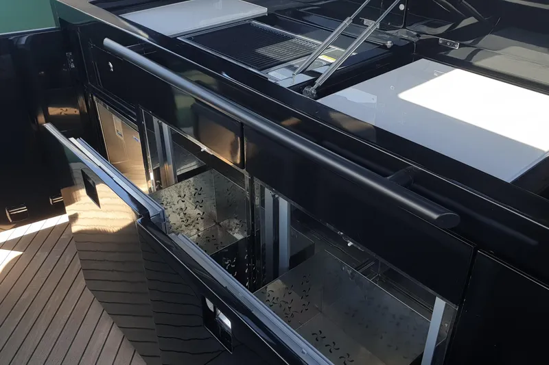  Yacht Photos Pics Luxury Canados Gladiator 493 yacht interior, featuring sleek black cabinetry and modern design, 2023 model.
