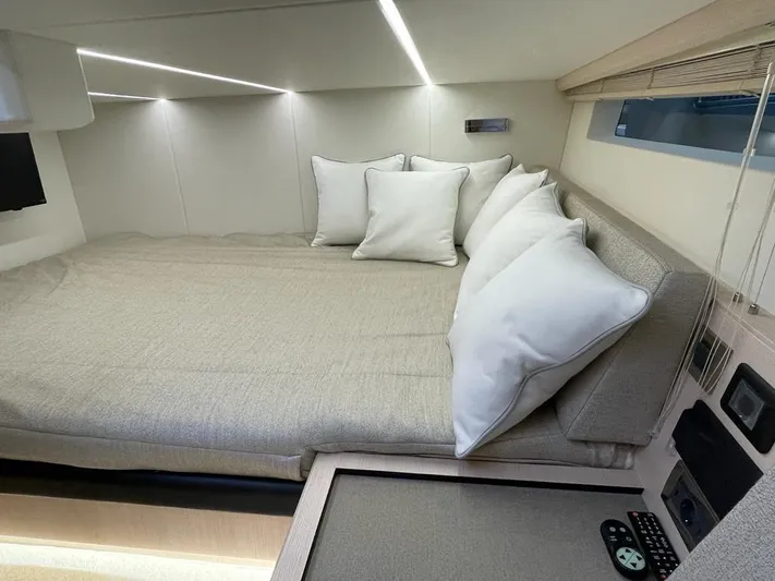  Yacht Photos Pics Luxurious 2023 MedYacht 42 cabin interior with cozy bed and modern lighting.