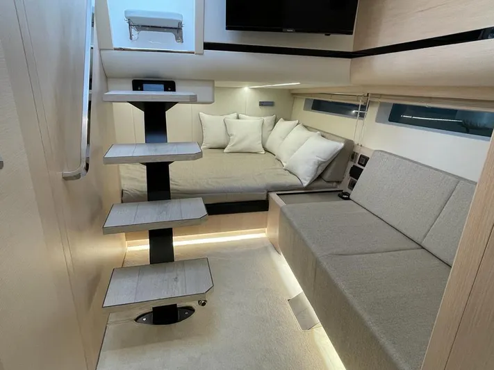  Yacht Photos Pics Luxurious interior of 2023 MedYacht 42, featuring modern seating and stylish staircase.