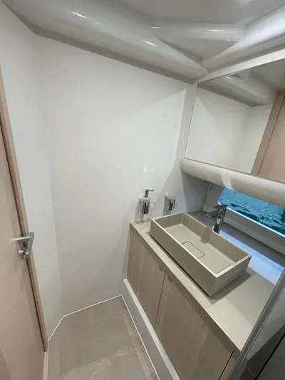  Yacht Photos Pics Modern bathroom interior on 2023 MedYacht 42, featuring sleek sink and minimalist design.