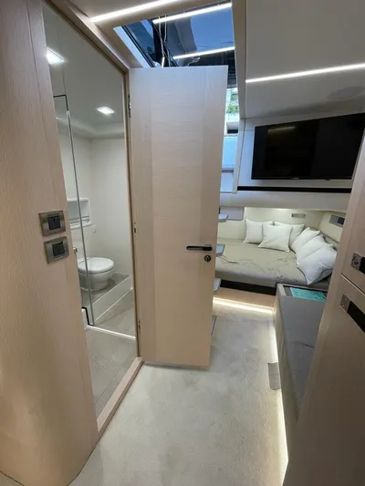  Yacht Photos Pics Luxurious interior of 2023 MedYacht 42 featuring modern bedroom and bathroom design.