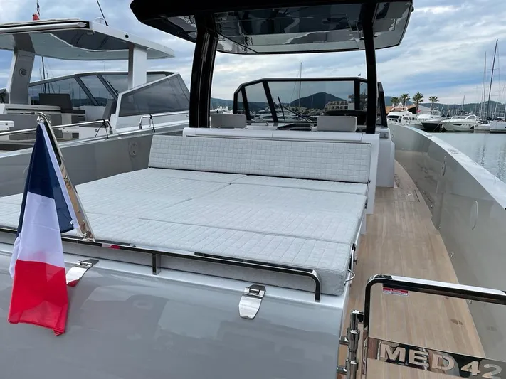 Yacht Photos Pics 2023 MedYacht 42 with spacious deck, French flag, docked at marina.