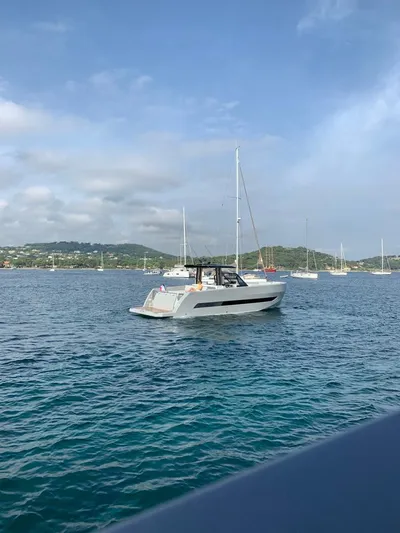  Yacht Photos Pics 2023 MedYacht 42 cruising on a serene blue sea with distant sailboats.